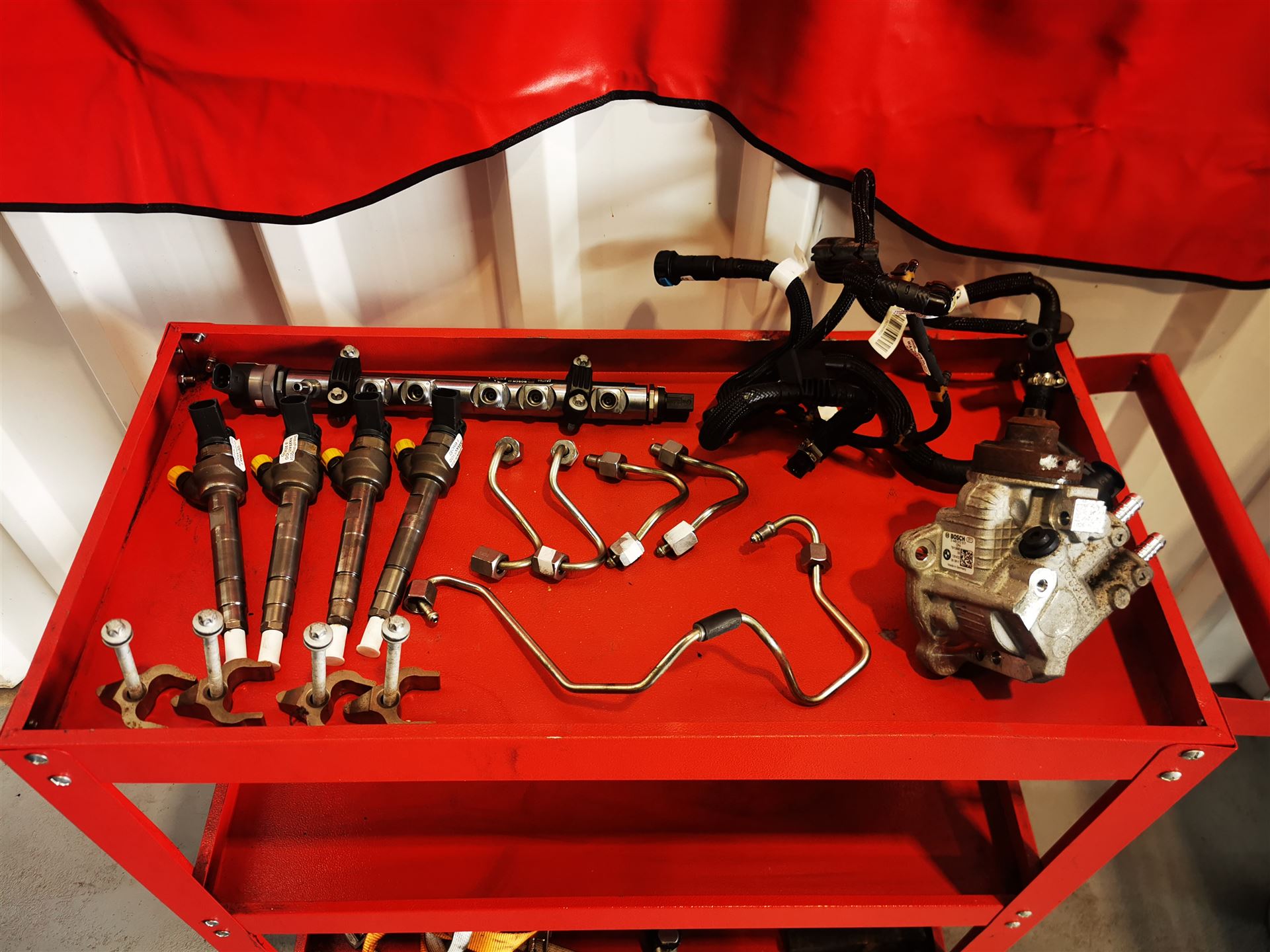 Diesel injectors and high-pressure fuel pump components at Car Avenue workshop in Ashbourne