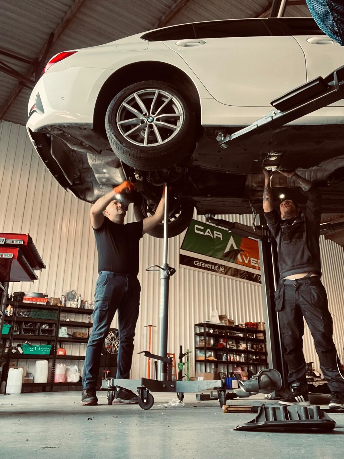 Mechanics carrying out gearbox and suspension work at Car Avenue workshop in Ashbourne